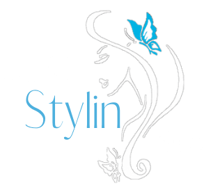 Just Stylin logo with light blue text and a delicate butterfly floral outline
