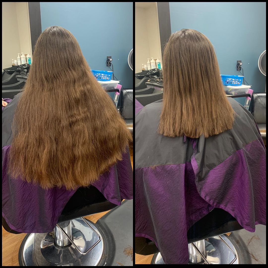 Back view of a person with long curly brown hair, showing before-and-after haircut results in a salon chair