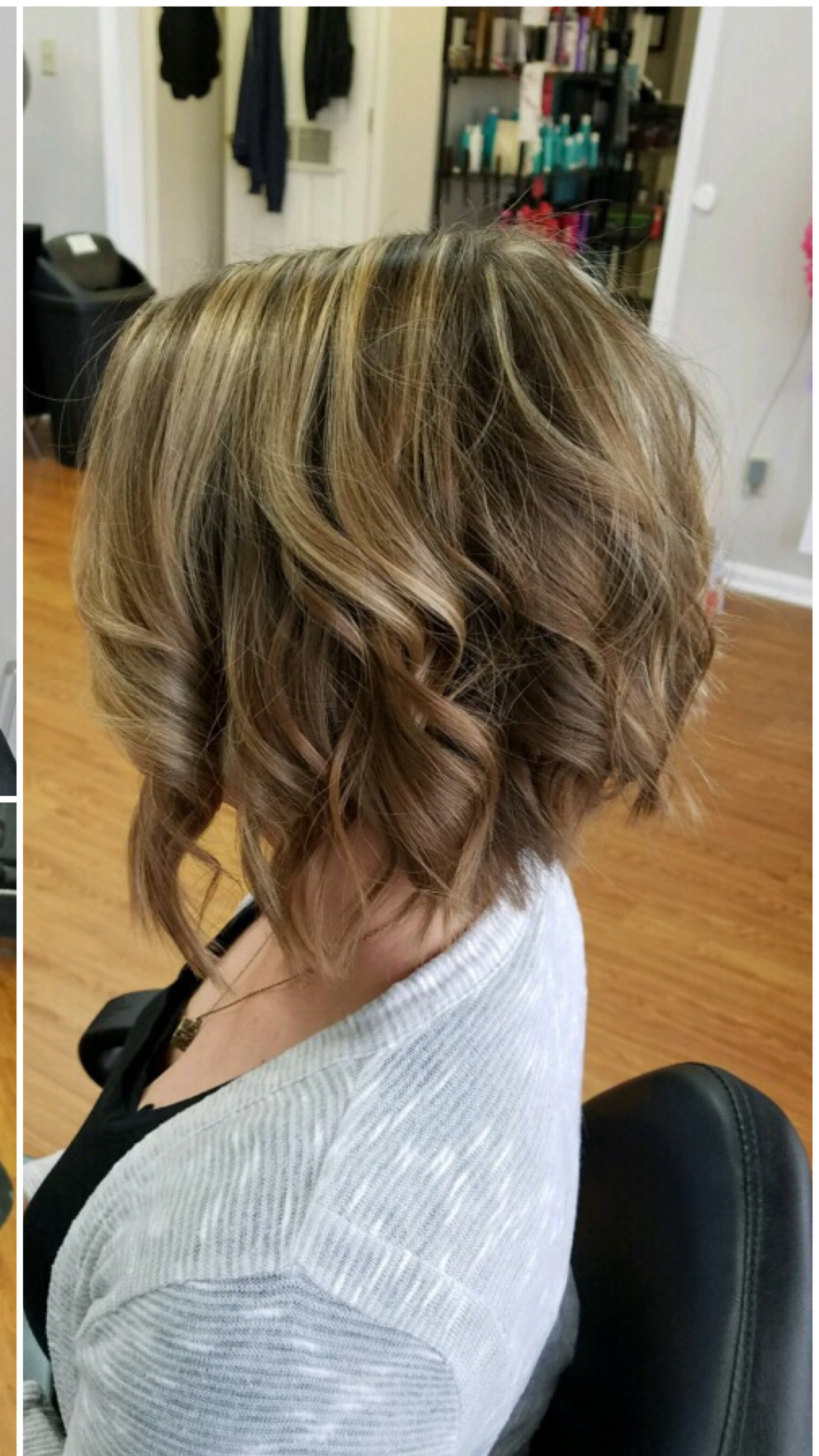 Side view of a short wavy blonde-brown haircut in a salon chair