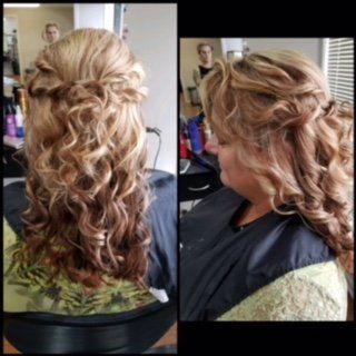 Side and back views of a blonde curled updo hairstyle with loose tendrils in a salon chair